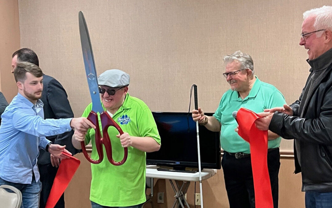 photo of Guiding Paws new office ribbon cutting with Jake Wyckoff, Andrew Crane, Dave Crane, and Rod Holter