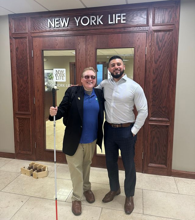 Andrew Crane outside of New York Life office after making a presentation about guide dogs